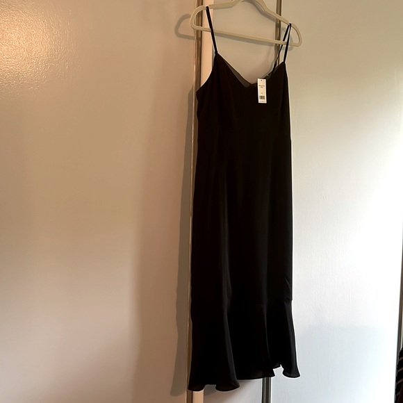 Banana Republic Dresses & Skirts - Banana Republic LBD, size 10, NWT, spaghetti straps, fitted with ruffle hem.
